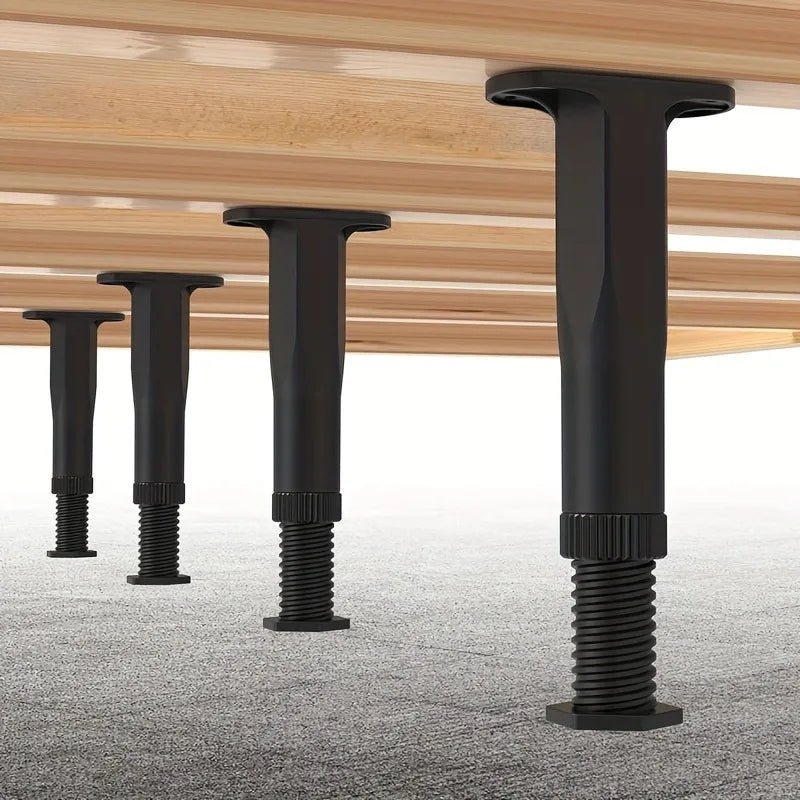 Six black adjustable bed support legs with threaded bases are shown against a wooden surface.