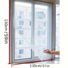 A close-up view of an invisible anti-mosquito window screen being pulled across a modern window frame.