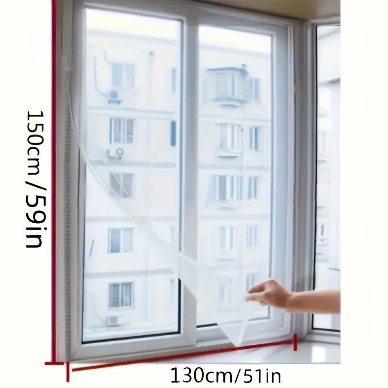 A close-up view of an invisible anti-mosquito window screen being pulled across a modern window frame.