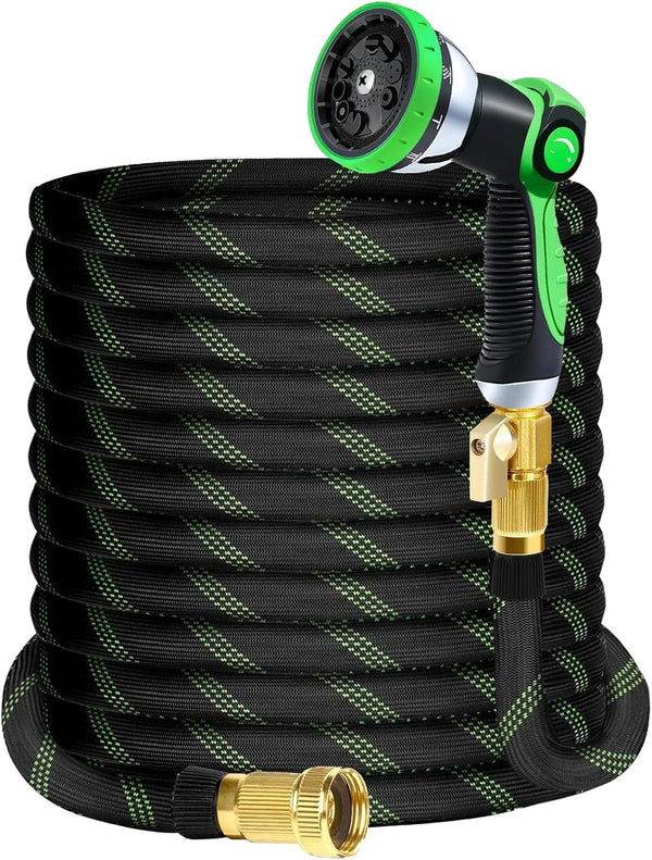 Black garden hose with a green spray nozzle and brass connector.