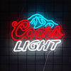 لافتة نيون تظهر كلمات COCOA LIGHT بخط نيون أحمر وأزرق على خلفية شبكية داكنة.