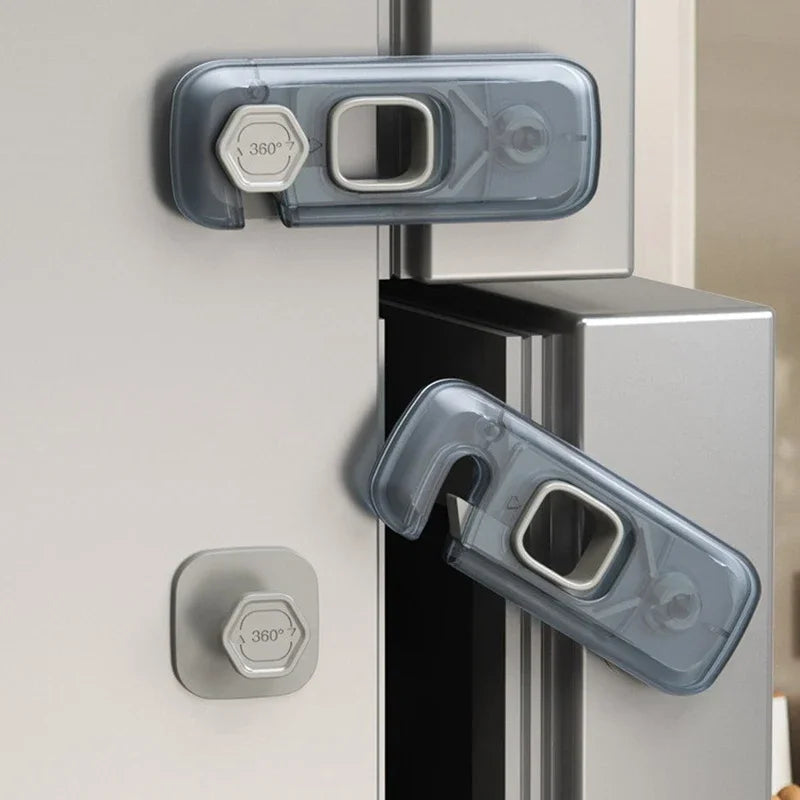 A set of three clear plastic safety locks for a cabinet door, including a 360 degree lock and a standard latch.