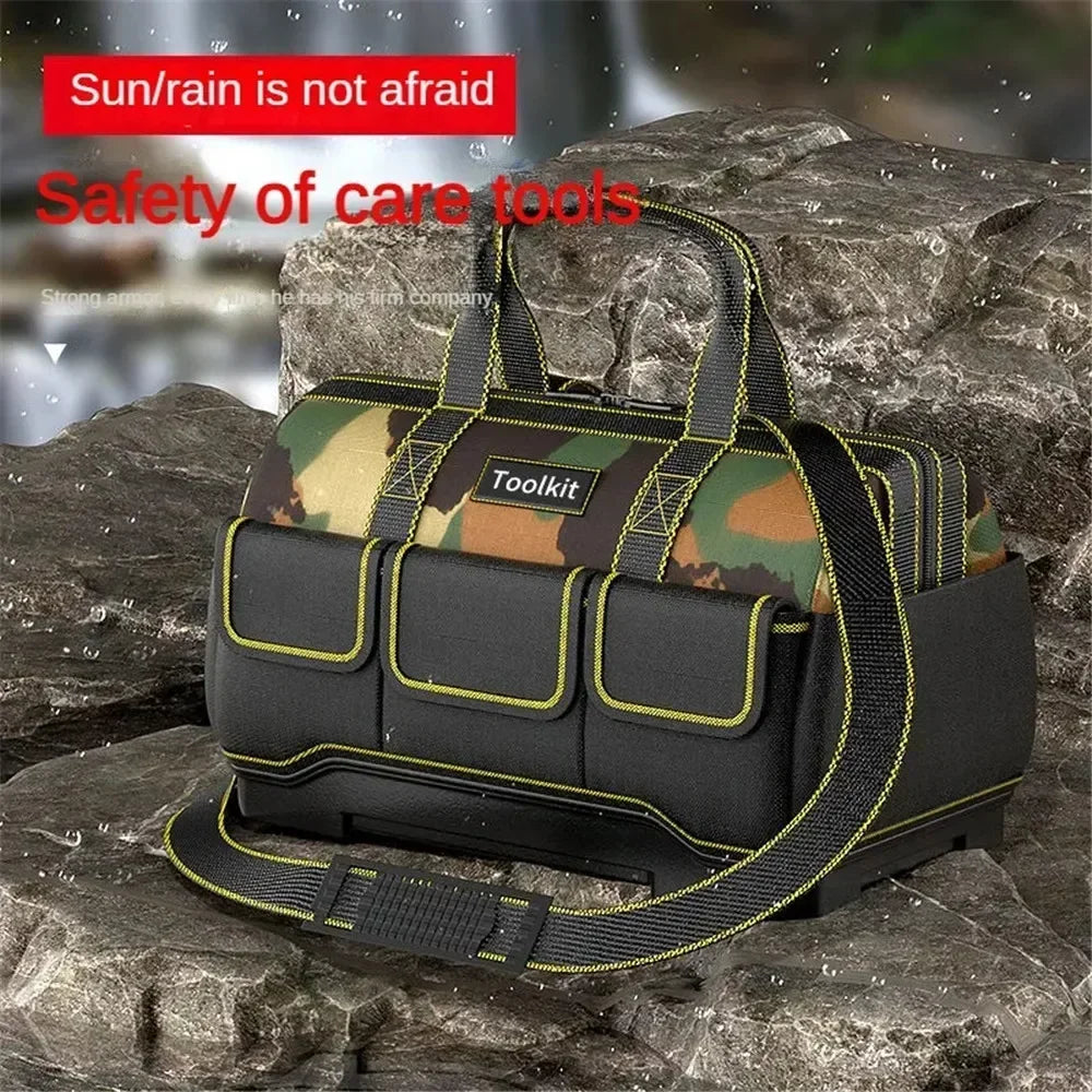 A black camouflage toolkit bag with yellow accents is shown resting on a dark rock surface.