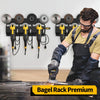A man is using a heavy-duty metal tool storage rack to prepare bagels on a cutting board.