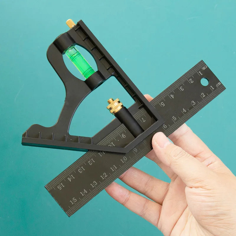 A hand holds a black precision measuring tool set with a green liquid and a ruler.
