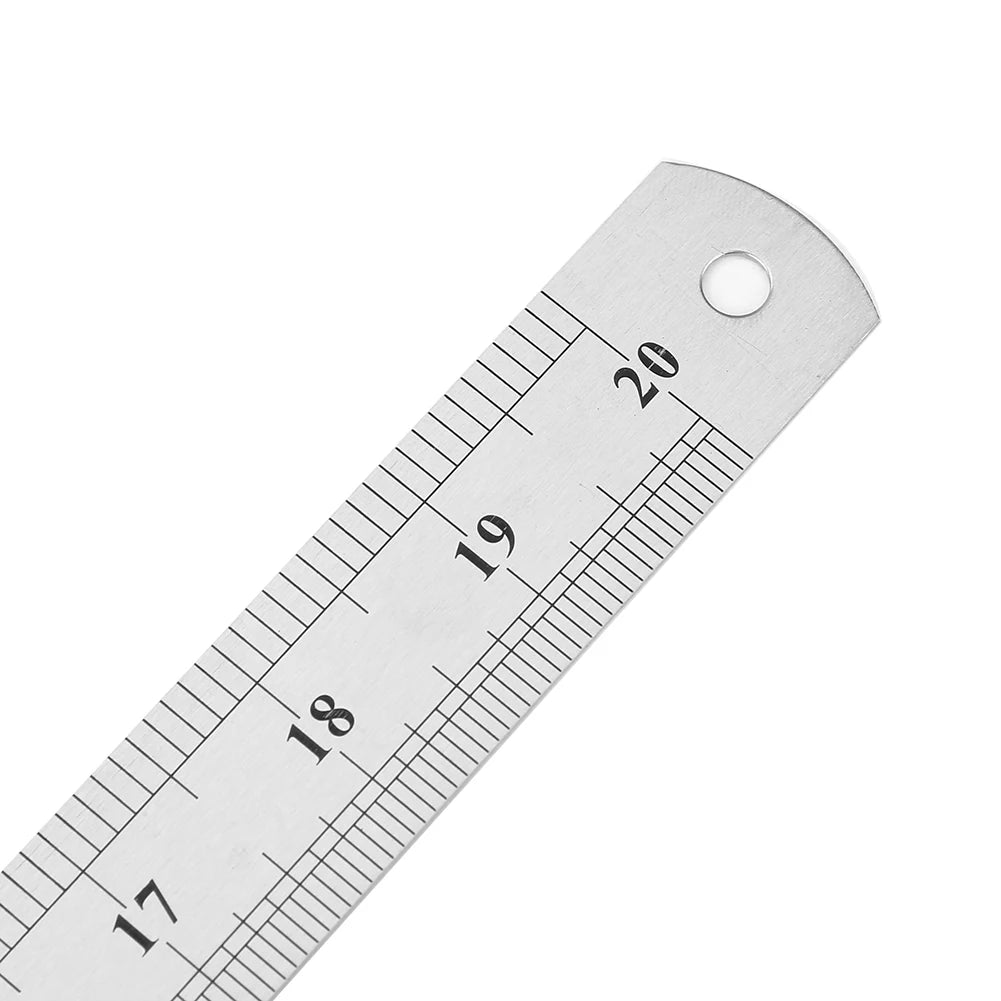 A stainless steel ruler showing markings from 17 to 20, used for measuring.