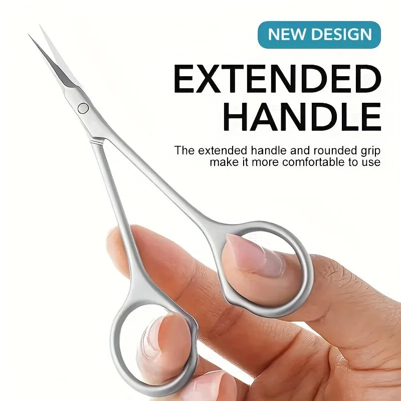 A hand holds a pair of stainless steel cuticle and nail clippers with an extended handle.