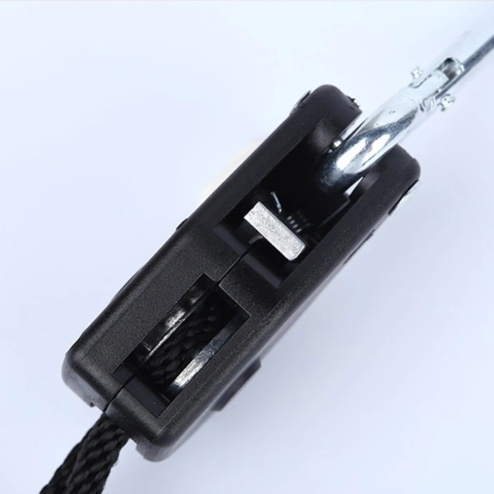A close-up view of a black utility lanyard with a silver metal clip and a black cord.