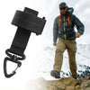 A man wearing tactical climbing gloves stands on a rocky, snowy terrain.