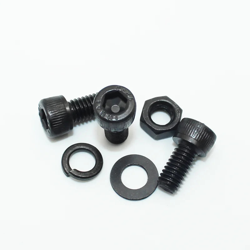 Assortment of black precision hex socket head cap screws and nuts.
