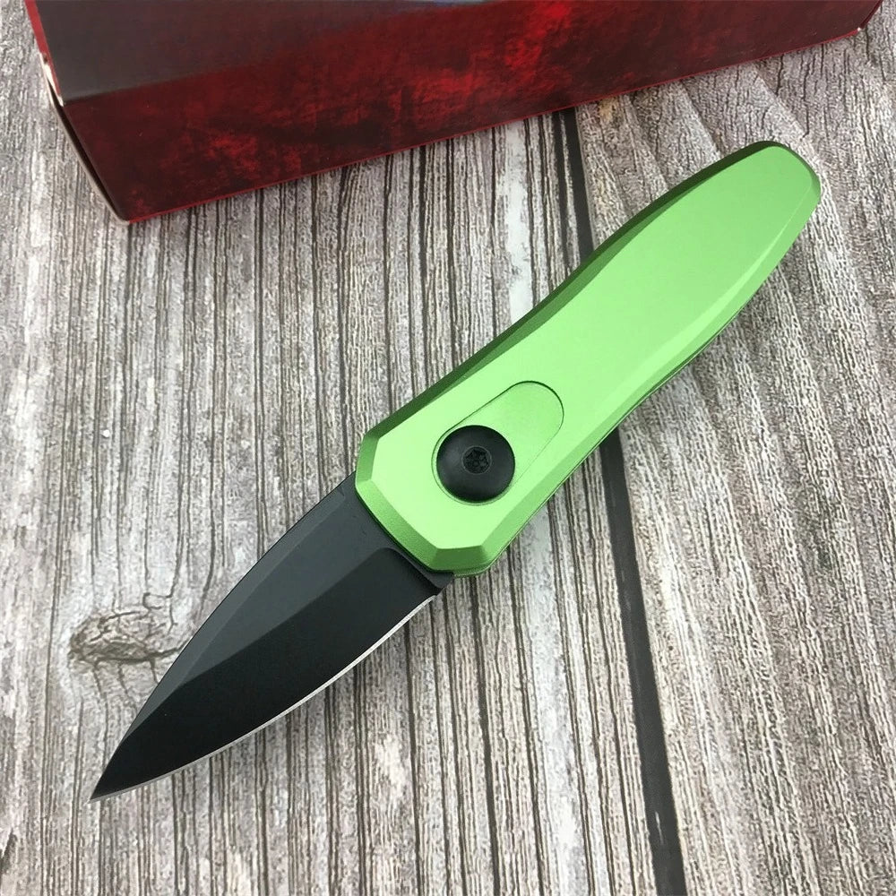 A bright lime green compact folding pocket knife with a black blade rests on a weathered wooden surface.