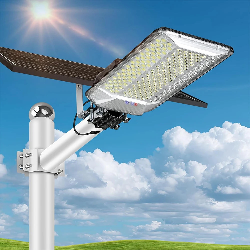 A high-power solar street light is mounted on a pole, shining a bright beam under a blue sky.