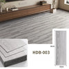 Gray wood grain floor tiles showing a rectangular tile and its thickness.