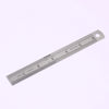 A stainless steel measuring ruler showing markings in inches.