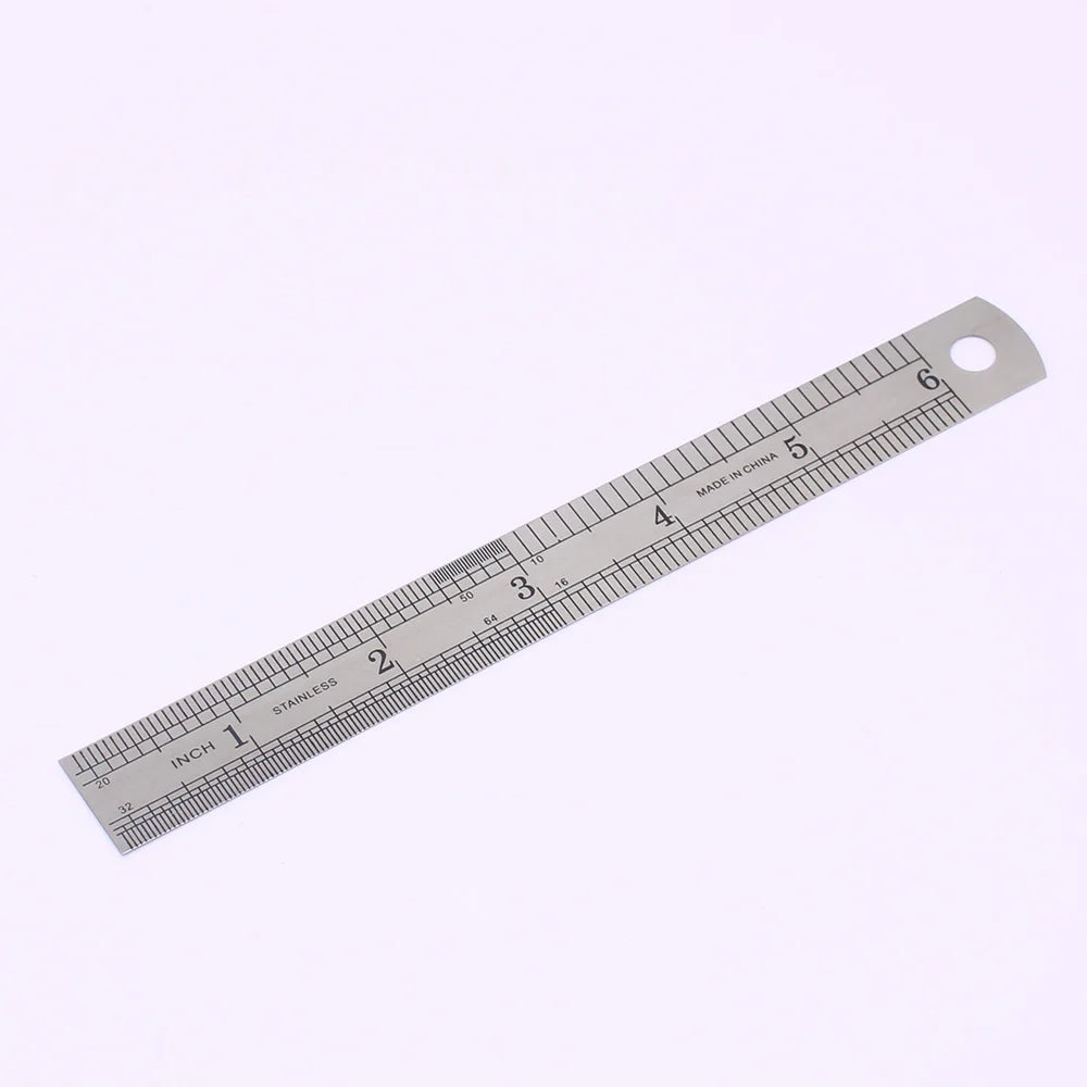 A stainless steel measuring ruler showing markings in inches.