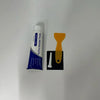A white tube of wall repair paste with an orange applicator and a black holder.