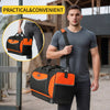 A man holds a black and orange heavy duty open top tool organizer bag in an outdoor construction setting.