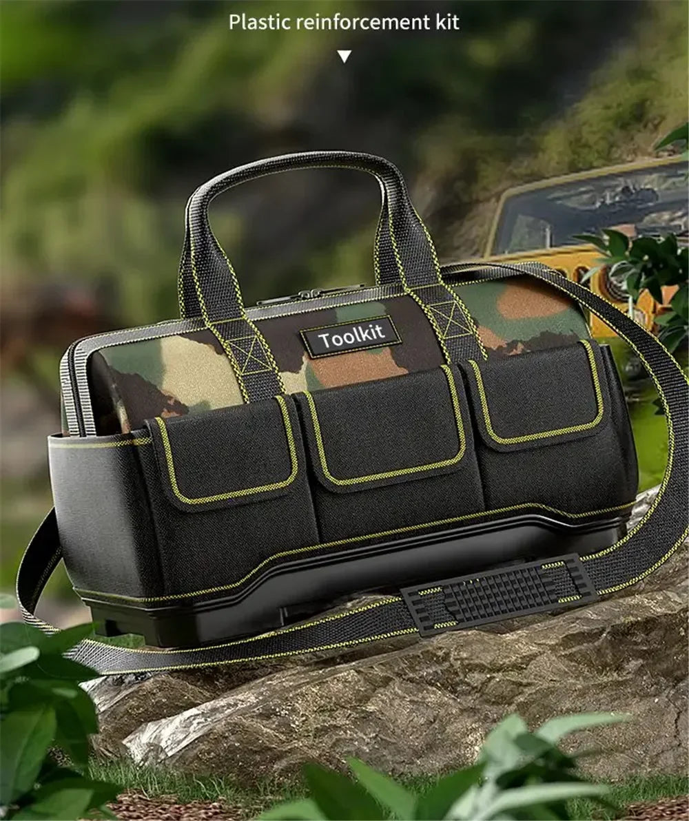 A black and olive green plastic reinforcement kit toolkit bag with a handle resting on a rock outdoors.
