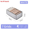 White fabric storage organizer box with seven grids for organizing textiles