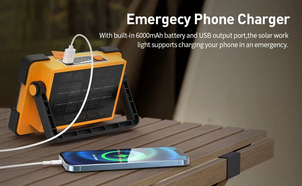 An emergency phone charger with a solar panel and USB output port is shown next to a smartphone.