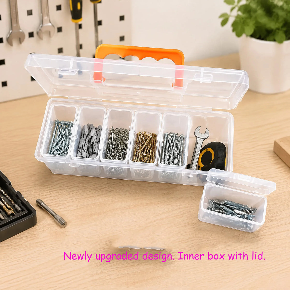 A clear plastic multi-compartment tool storage box with an orange lid, holding various small tools and hardware.