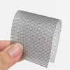 Roll of black heavy duty self-adhesive mesh repair tape being held by a hand
