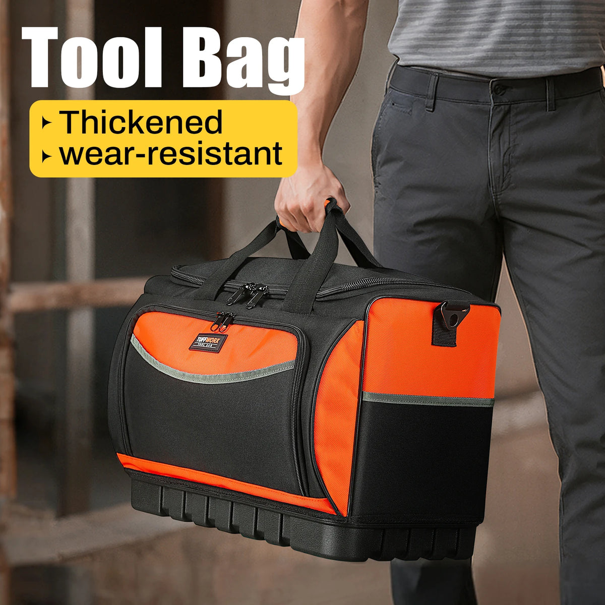 A person holds an orange and black tool bag, highlighting its thickened and wear-resistant features.