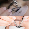 Hands using precision stainless steel tweezers to apply eyebrow makeup or hair styling.