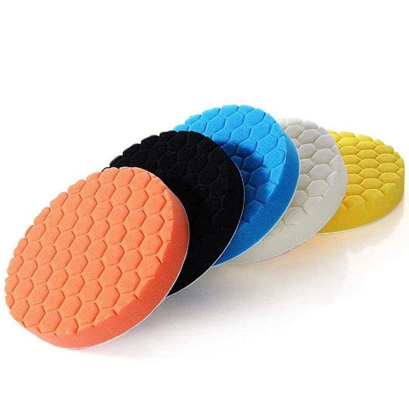 A set of five compound buffing polishing pads in various colors including orange, black, blue, white, and yellow.