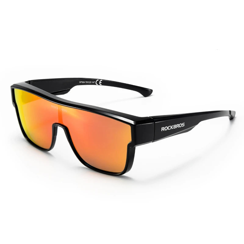 Black sunglasses with orange-tinted lenses shown against a white background.