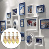 Collection d'ancrages auto-forants pour plaques de plâtre, de différentes tailles et finitions, fixés sur un mur blanc.