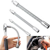 A set of chrome adjustable wrench extension bars shown next to a hand.
