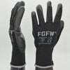 A pair of black durable work gloves with reinforced palms and various certification logos