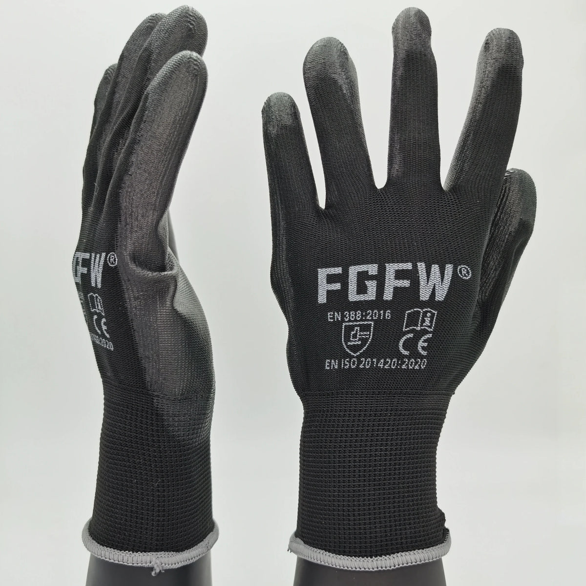 A pair of black durable work gloves with reinforced palms and various certification logos