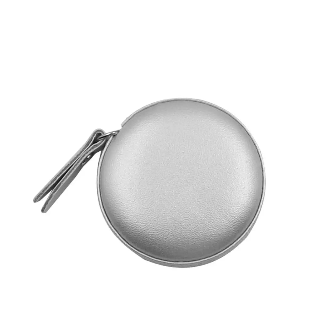 Silver retractable dual scale measuring tape with a protective cover.