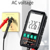 A black digital multimeter shows AC voltage measurement, next to a power outlet and test leads.