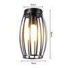 A black, vertical, cage-style LED chandelier lamp with a clear glass shade.