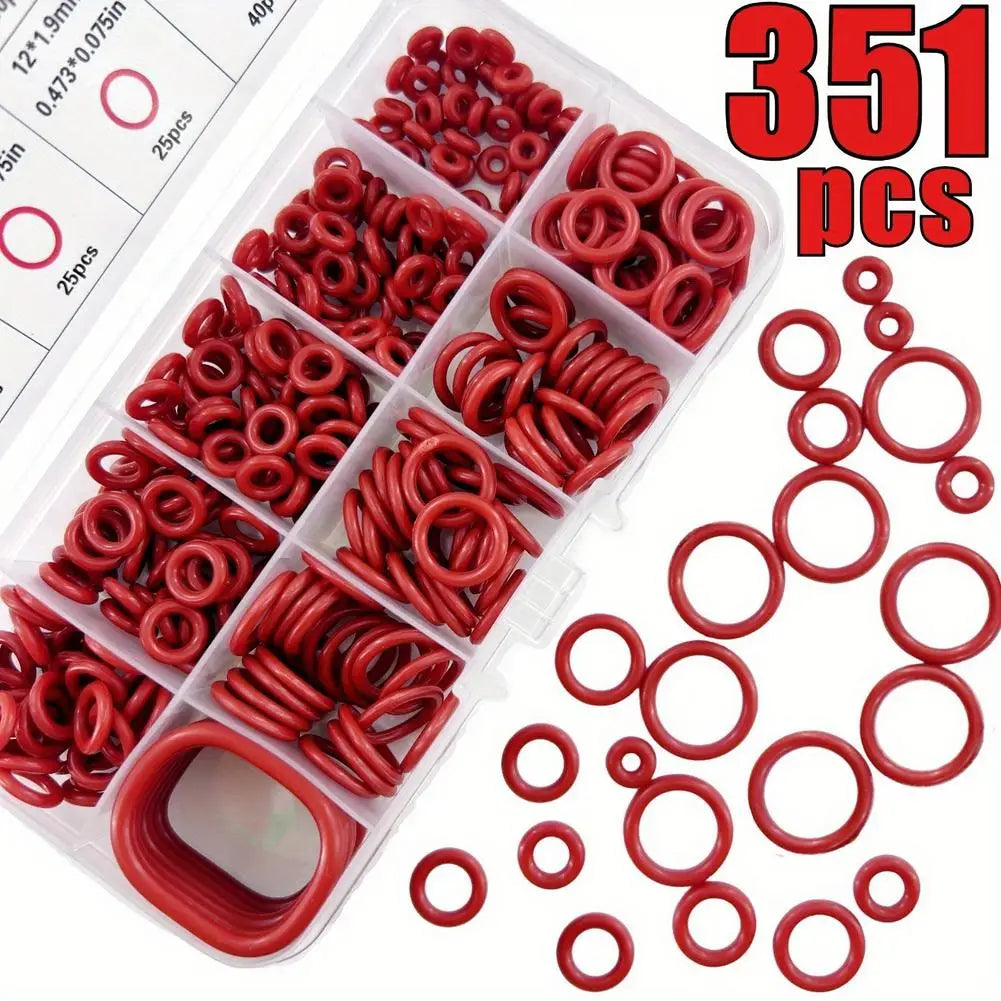 A plastic container filled with various sizes of red silicone O-rings and a loose pile of red O-rings.