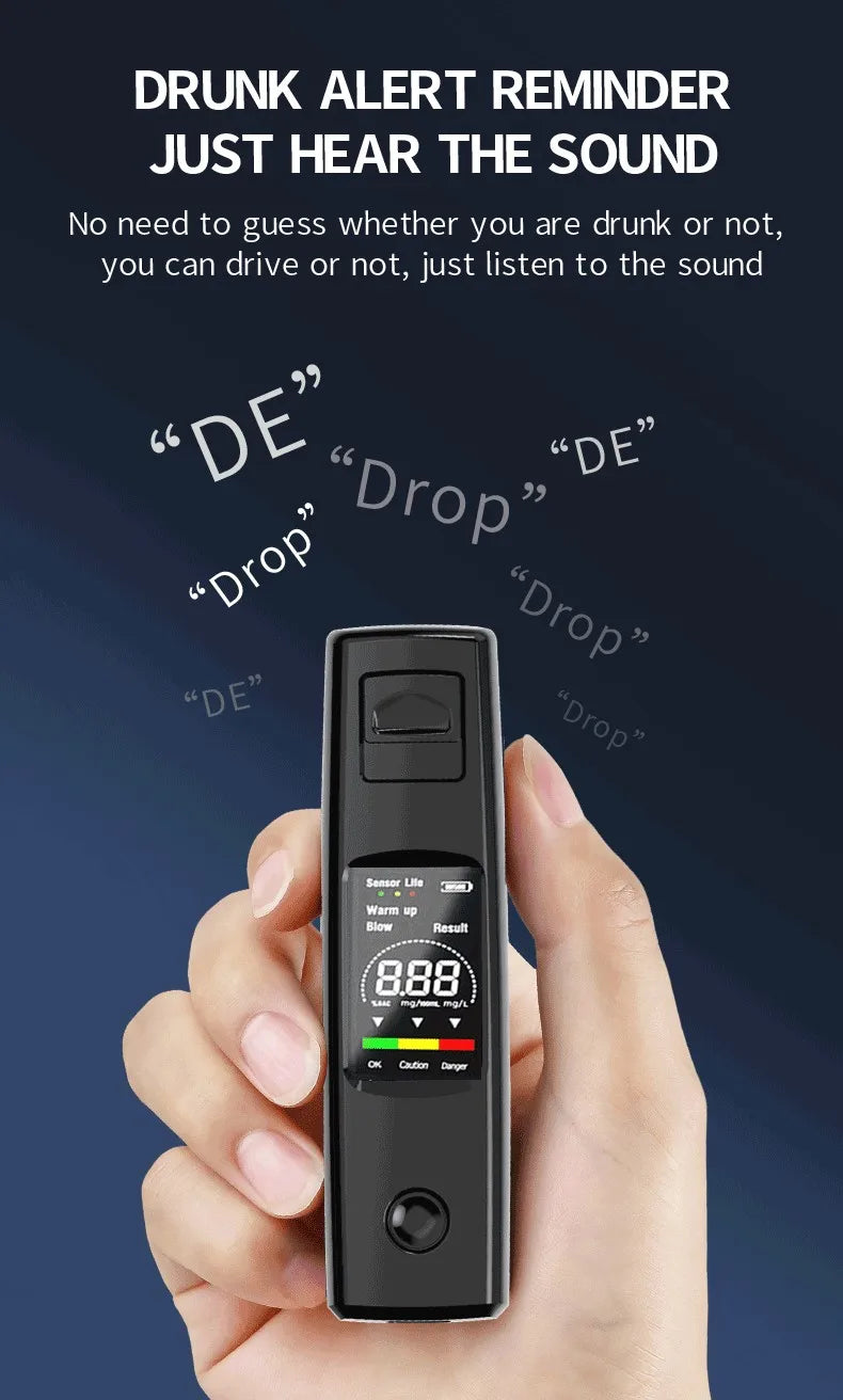 Une main tient un testeur portable numérique d'alcool de couleur noire.
