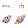 A set of F13 electrical push-in connectors with orange wires and gray plastic housing.