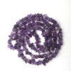 A circular arrangement of purple natural stone agate beads for DIY jewelry making