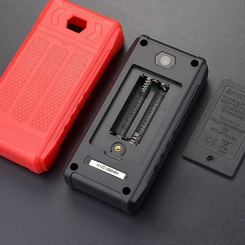 A red and black digital multimeter is shown with its protective case and leads on a dark surface.