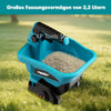 A blue cordless handheld spreader tool is shown in a grassy outdoor setting.