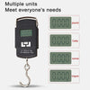 A black portable digital fishing scale with a hook, showing various units like pound, catty, ounce, and kilogram.