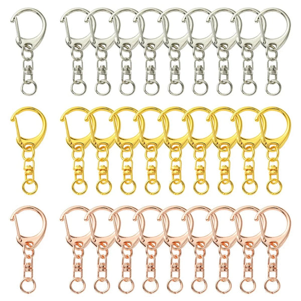 A collection of silver and gold lobster clasp key rings for DIY jewelry making