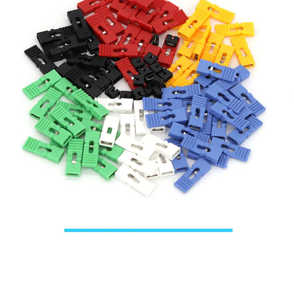Assortment of jumper cap connectors in various colors including red, black, yellow, blue, and green.
