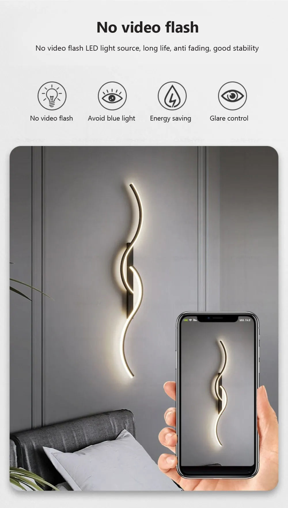 A modern, curved LED wall sconce illuminates a wall in a dimly lit indoor setting.
