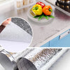 Self-adhesive aluminum foil contact sheets showing various decorative patterns and food items