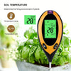 An orange soil temperature meter displays 28 degrees Celsius, measuring the living environment of plants.