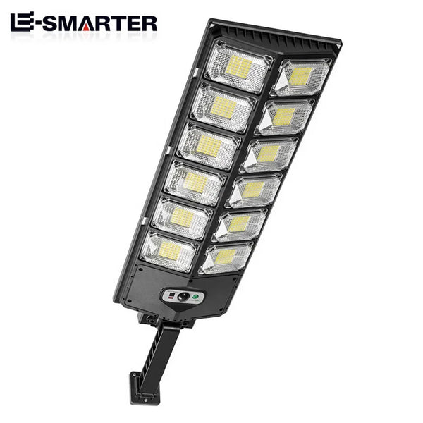 A black solar powered LED motion sensor outdoor garden light with multiple bright LED panels.